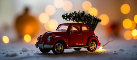 tiny red car hauling a christmas tree photo