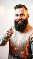 bearded man smiles points at the viewer wearing a light sweater with string lights. photo