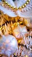 close- a frosted christmas ornament with a silver snowflake photo