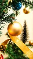 single golden ornament adorns a pine branch photo