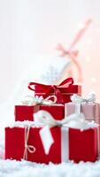 stack festive gift boxes adorned with ribbons photo