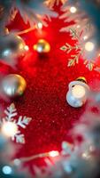 festive sparkle - golden ornaments snowflakes on a glittery red surface photo