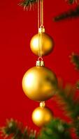 three golden ornaments on a red background photo