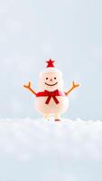plastic snowman figurine with a red bow star photo