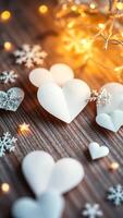paper hearts snowflakes a glowing star on a rustic wood surface photo