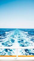 white foamy wake from a boat sailing on the ocean photo
