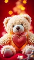 plush bear holds a red heart photo