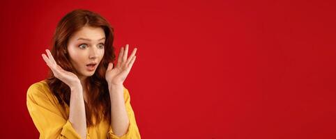 Omg. Surprised Girl Looking Aside Holding Hands Near Face Posing On Green Background In Studio. Empty Space photo