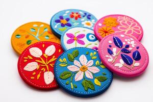 A collection of vibrant embroidered floral patches, each featuring intricate designs with colorful threads photo