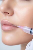 A close-up image of a cosmetic procedure, where a syringe is applied to a womans lips for a dermal filler injection photo
