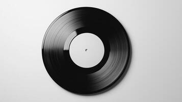 A minimalist image of a black vinyl record with a blank white label, set against a clean, neutral background. photo