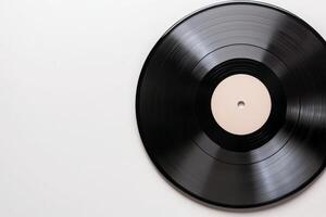 A close-up of a vinyl record with a blank black label on a white background, showcasing its grooves and glossy finish photo