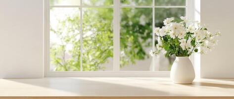 A bright, sunlit room with a wooden table near a large window photo