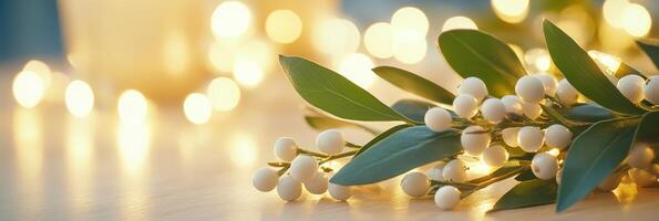 Close-up of mistletoe leaves and berries illuminated by soft golden lights during winter celebrations photo