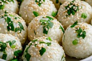 Close-up of vibrant green rice balls adorned with sesame and fresh herbs in an oriental setting photo