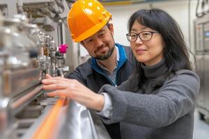 Engineers collaborate on machinery inspection in a modern production line with robotic technology photo