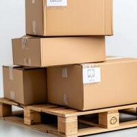 Close-up of stacked cardboard boxes on a wooden pallet with shipping labels on a white background photo