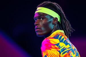 Dynamic tennis player in abstract colorful uniform ready to serve against energetic backdrop photo