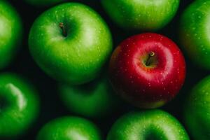 A single red apple stands out among green apples in a minimalistic setting showcasing diversity and uniqueness photo