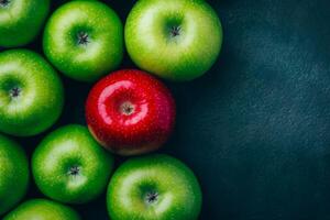A single red apple contrasts against several green apples from a top view highlighting uniqueness and diversity photo
