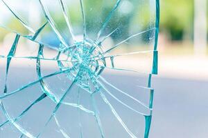 Close-up of shattered glass window highlighting forensic evidence in high detail with blurred background effect photo