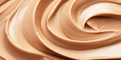 Rich and smooth close-up of warm caramel flowing with a luxurious texture and deep brown tones under soft lighting photo