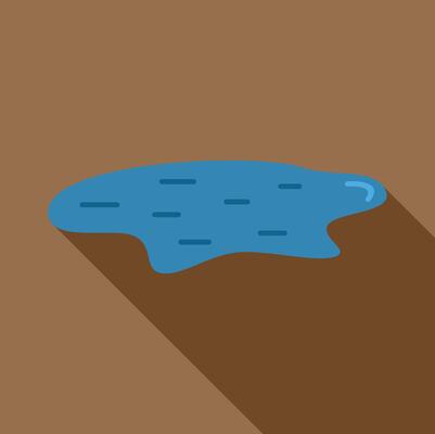 Small puddle of water on the ground reflecting light