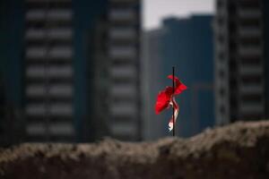 Metal survey peg with red flag on construction site. foundation laying. Building construction. photo