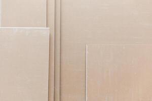 Close up of plasterboard, a type of drywall made of plaster between two sheets of heavy paper, building concept photo