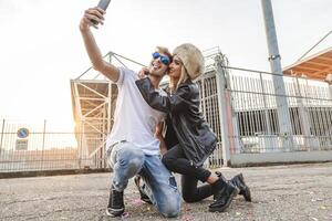 couple of young beautiful lovers take a selfie on the large square photo