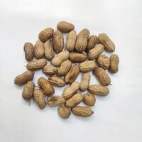 Monkey nuts, peanuts on white background photo
