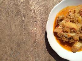 Padang Jackfruit Curry is one of the dishes that must be enjoyed when going to a Padang restaurant. The characteristic of the jackfruit curry is the thick color. photo