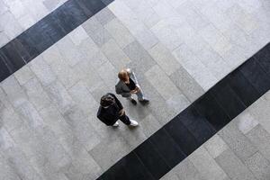 Top view of team of diversity business people are discussing over new strategic strategy project on investment real estate while walking around the office building for new project and planning photo