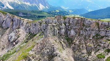 Tourists hiking on mountain path approaching cliff video