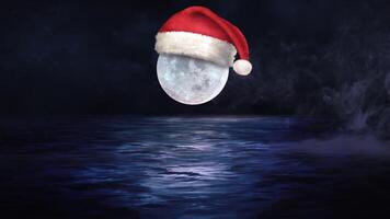 Santa Cap on Moon at Midnight 4K features a full moon with a Santa cap on the moon over water with snow and rolling fog. video