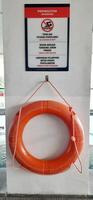 Plastic orange safety swimming pool rings. Lifebuoy ring buoy on the wall. Bandung, West Java, Indonesia - October 29 2024 photo