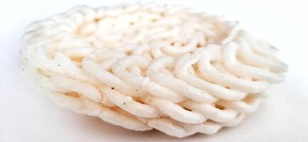 White noodle crackers or kerupuk putih or kerupuk warung made from tapioca flour, snack food from Indonesia isolated on white background photo