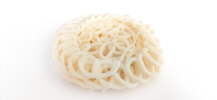 White noodle crackers or kerupuk putih or kerupuk warung made from tapioca flour, snack food from Indonesia isolated on white background photo