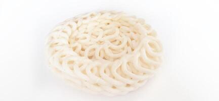 White noodle crackers or kerupuk putih or kerupuk warung made from tapioca flour, snack food from Indonesia isolated on white background photo