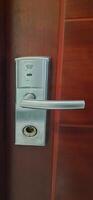 Hotel door lock security system for access protection on wooden door photo