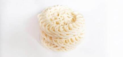 White noodle crackers or kerupuk putih or kerupuk warung made from tapioca flour, snack food from Indonesia isolated on white background photo