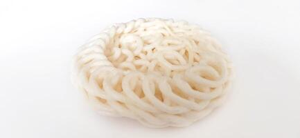 White noodle crackers or kerupuk putih or kerupuk warung made from tapioca flour, snack food from Indonesia isolated on white background photo