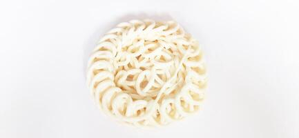 White noodle crackers or kerupuk putih or kerupuk warung made from tapioca flour, snack food from Indonesia isolated on white background photo
