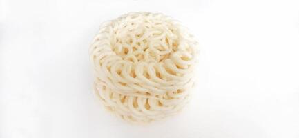 White noodle crackers or kerupuk putih or kerupuk warung made from tapioca flour, snack food from Indonesia isolated on white background photo