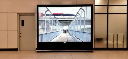 The atmosphere of KCIC Halim station, WHOOSH fast train, route Jakarta - Bandung. Modern passenger train moving fast on railway platform. Commercial transportation. Jakarta, Indonesia, October 28 2024 photo