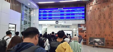 The atmosphere of KCIC Halim station, WHOOSH fast train, route Jakarta - Bandung. Modern passenger train moving fast on railway platform. Commercial transportation. Jakarta, Indonesia, October 28 2024 photo