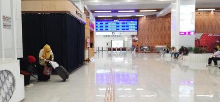 The atmosphere of KCIC Halim station, WHOOSH fast train, route Jakarta - Bandung. Modern passenger train moving fast on railway platform. Commercial transportation. Jakarta, Indonesia, October 28 2024 photo
