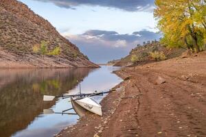 rowing shell on shore of Horsetooth Reservoir in northern Colorado, October scenery photo