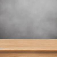 Empty wooden table with black-grey blur wall background photo