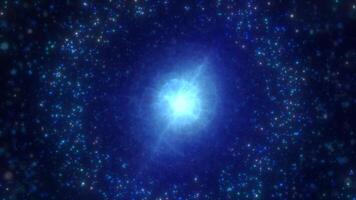 A vibrant blue nebula sphere with a bright core, surrounded by shimmering particles in a star-filled cosmic background video